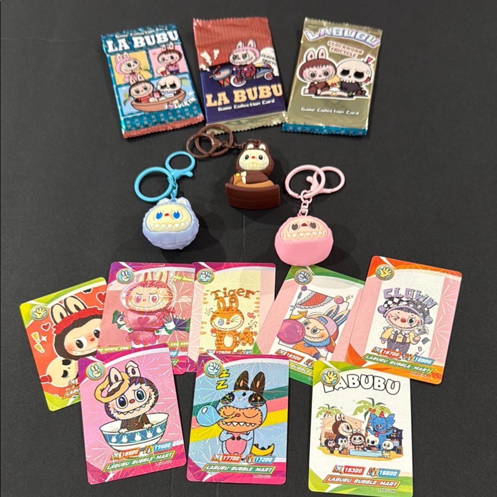 Unlisted pick one Keychain and 2 packs of trading cards —-Cards and Keychains